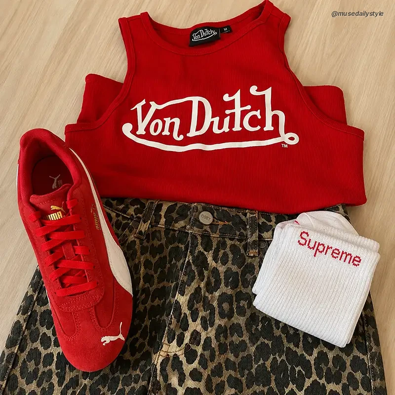 Red Von Dutch tank top styled with cheetah print jeans, red Puma sneakers and folded Supreme socks